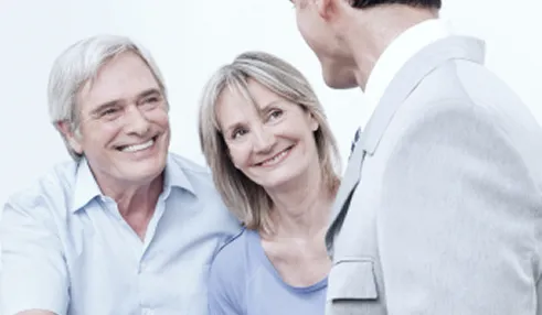 old couple meeting their attorney